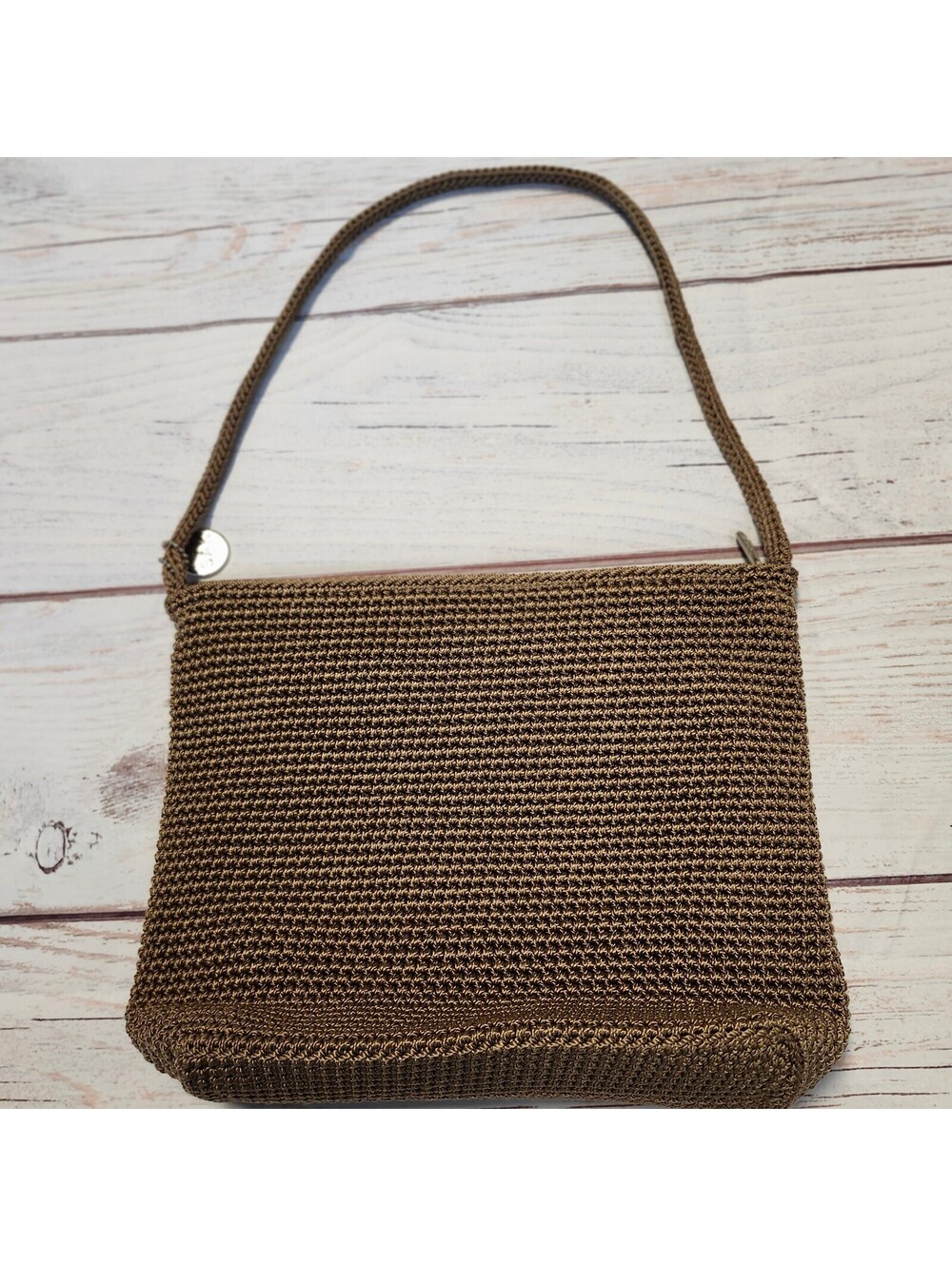 The Sak Brown Crochet Shoulder Bag with Zipper Closure